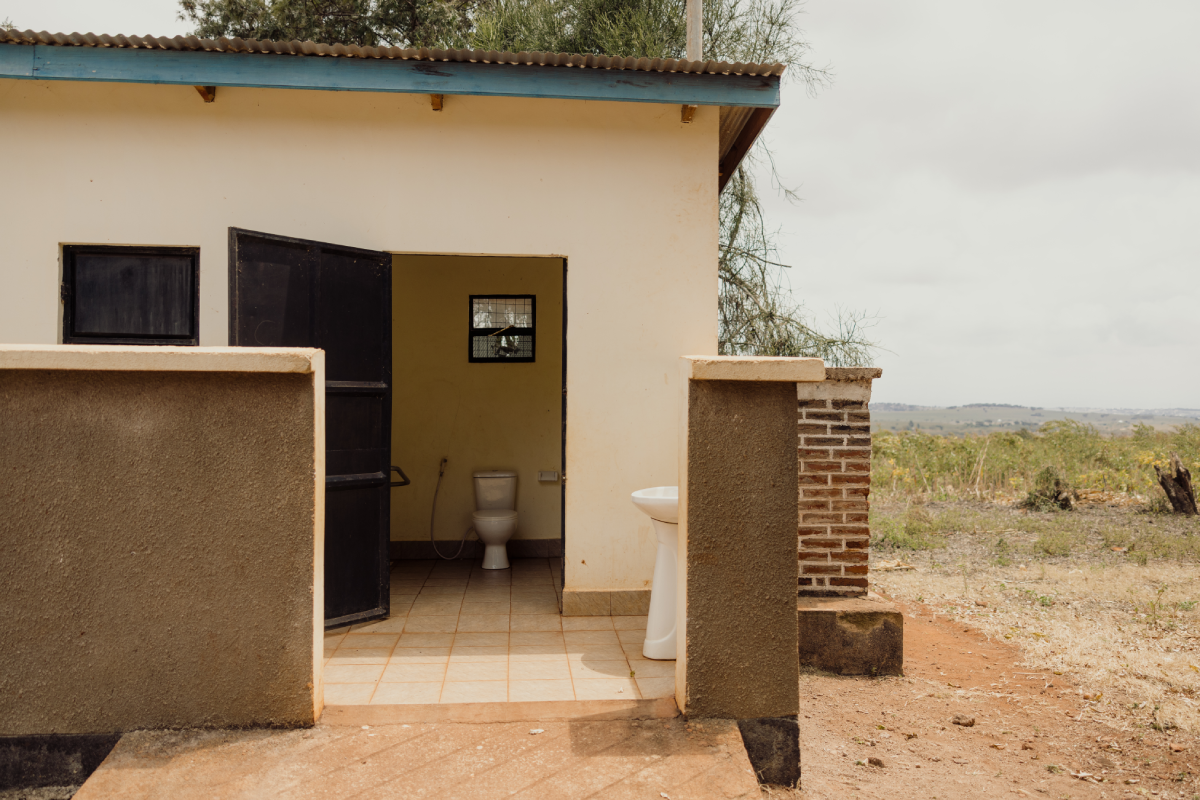 The new girl-friendly washroom at Glory’s school. Through the doorway, there’s a flush toilet and a sink for handwashing.